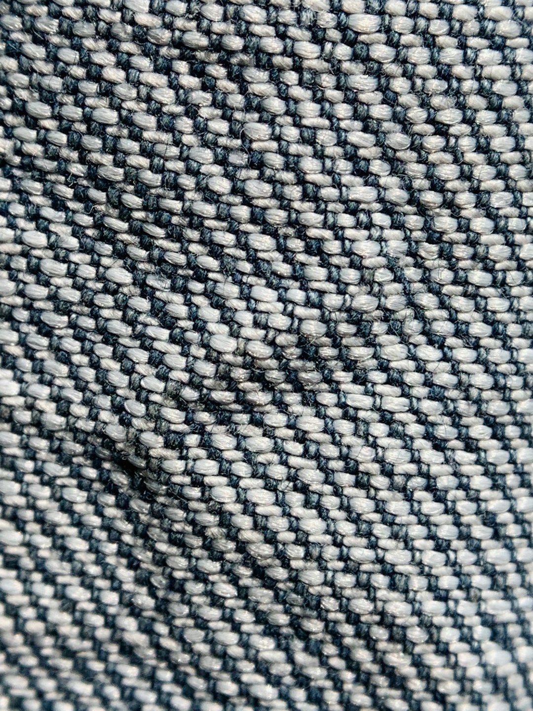 a-close-up-view-of-a-blue-and-white-fabric-lbupnc6g0zs